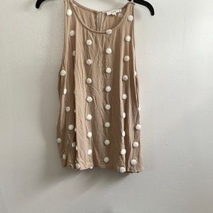 Tan tank with white poms